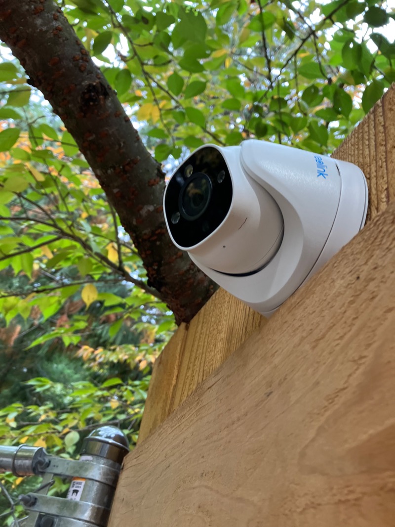 Security camera on fence representing access control and monitoring