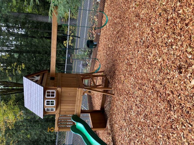 Outdoor area with woodchips and fencing for safety